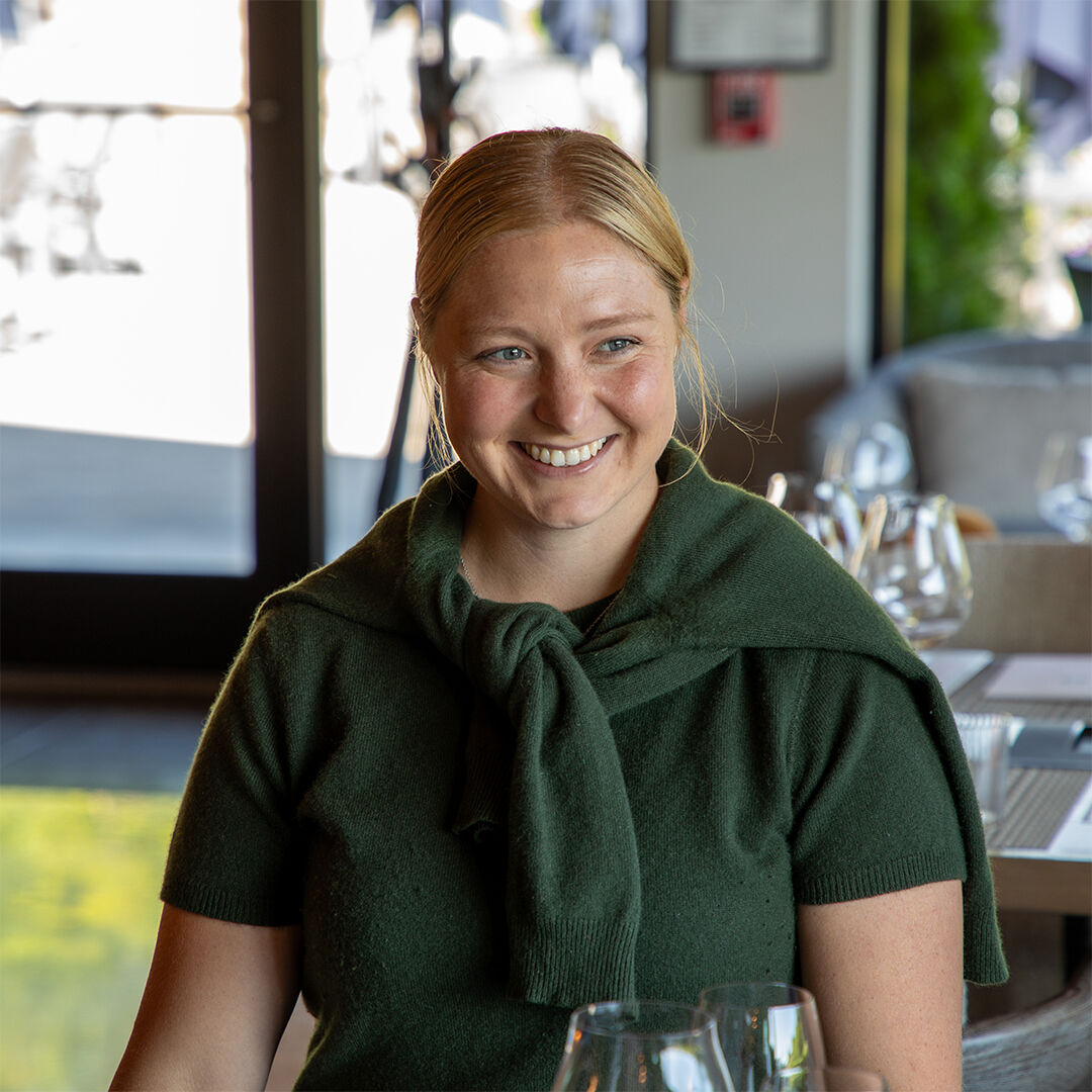 Haley Vachter sitting for a tasting in WillaKenzie Estate tasting room